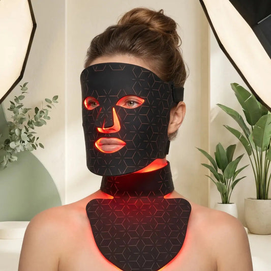 Woman using an LED light therapy mask correctly at home