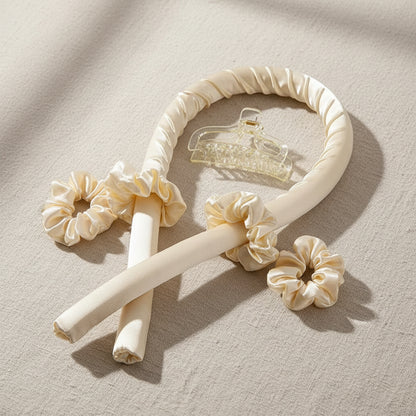 Cream-colored headband with decorative bows on a white background