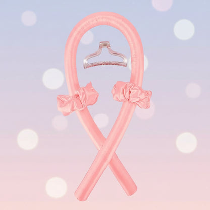 Pink hangers with decorative bows on a white background
