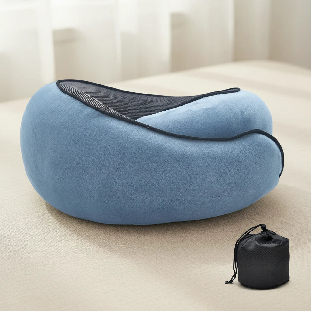 Blue travel pillow with black carrying case on a light surface