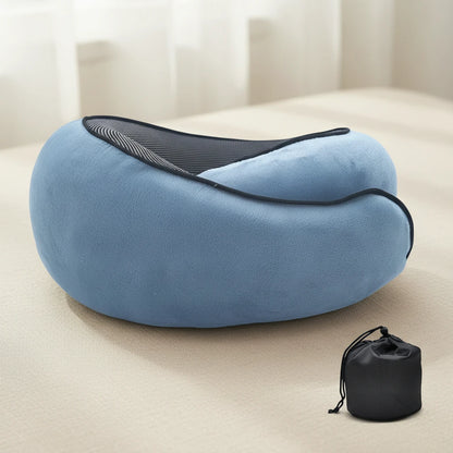 Blue travel pillow with black carrying case on a light surface