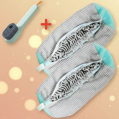 Two gray cleaning brushes with teal accents and a scrubber on a white background
