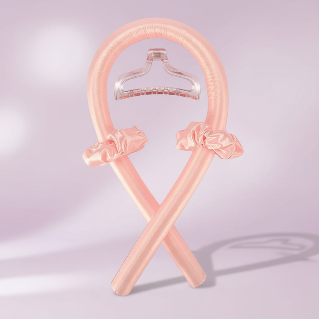 Pink inflatable hangers with bow decorations on a white background