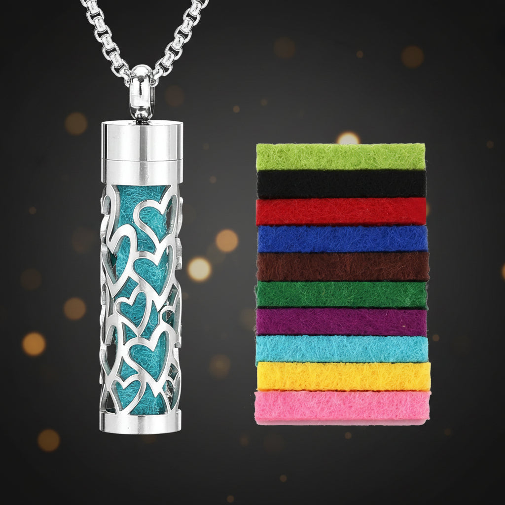 Cylindrical metal urn with decorative heart patterns on a white background, accompanied by a colorful striped card.