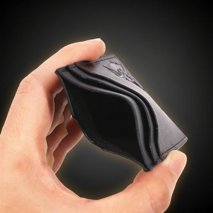 Hand holding a black leather wallet against a white background