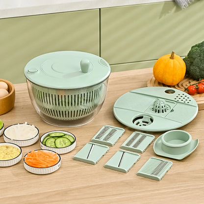 Vegetable chopper set with various attachments on a kitchen counter.