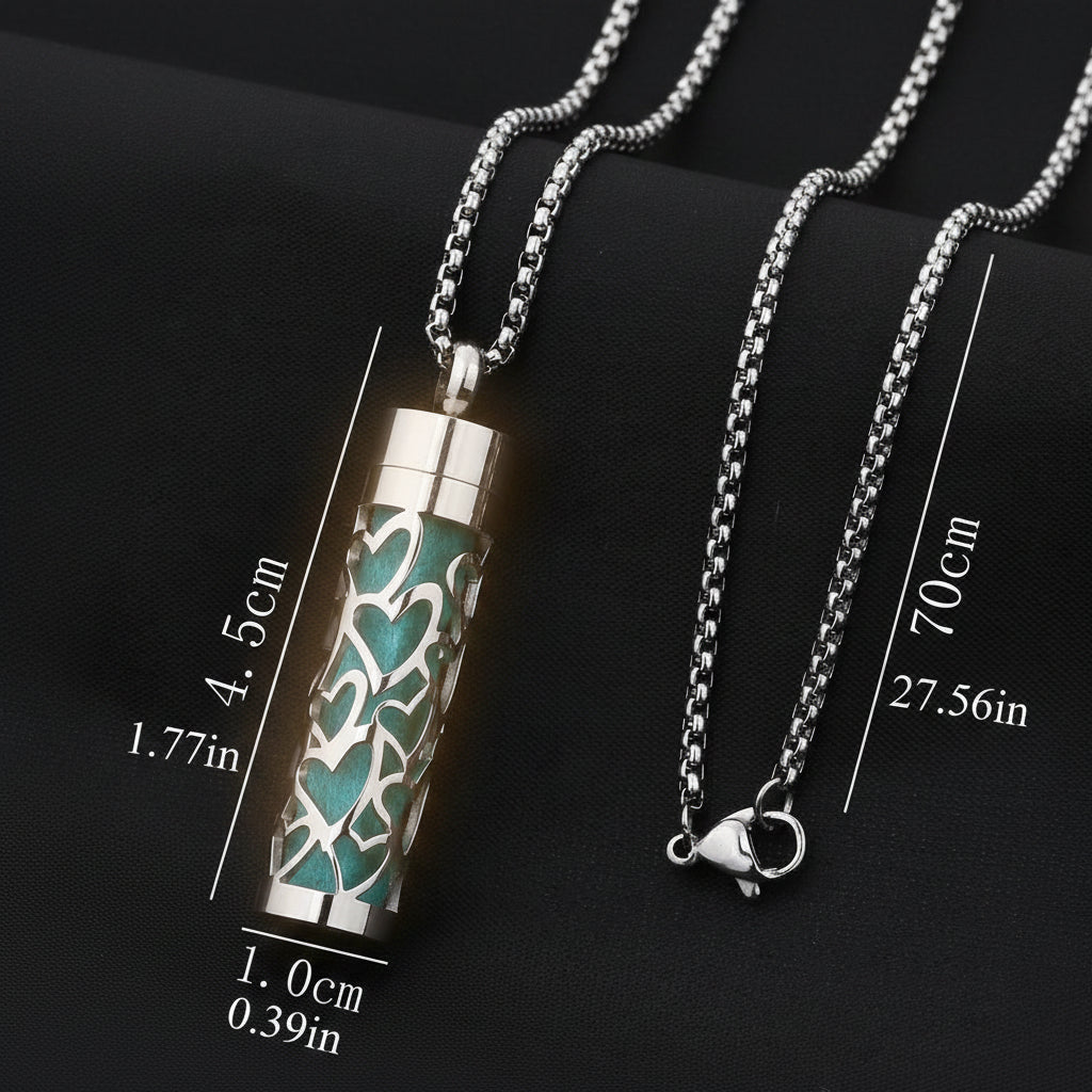 Cremation urn necklace with chain, measurements on a black background