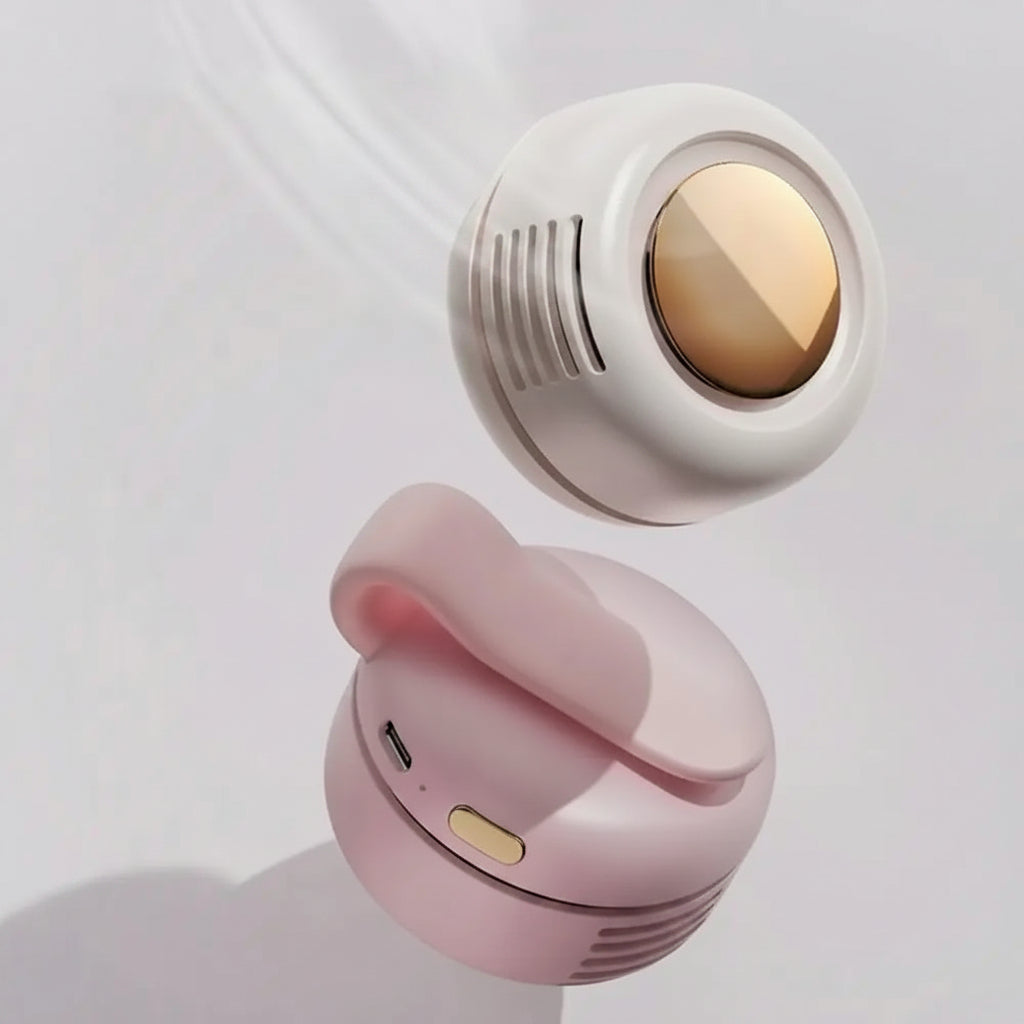 Pink and white earbuds with gold accents on a light gray background