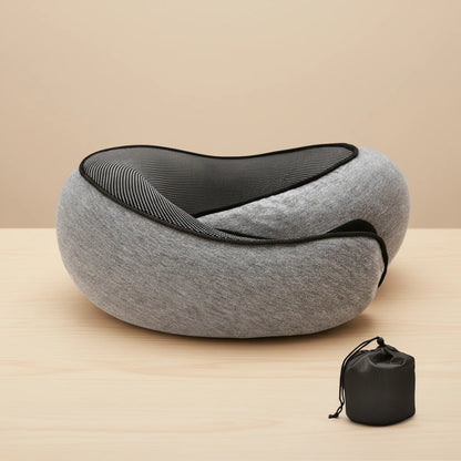 Gray neck pillow with black mesh on a wooden surface, accompanied by a black carrying bag.