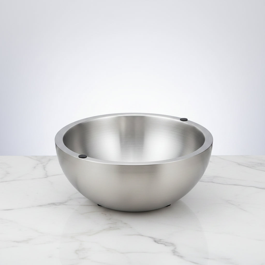 Stainless steel bowl on a white background