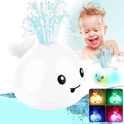 Child playing with a toy whale in water, showing colorful lights on a screen.